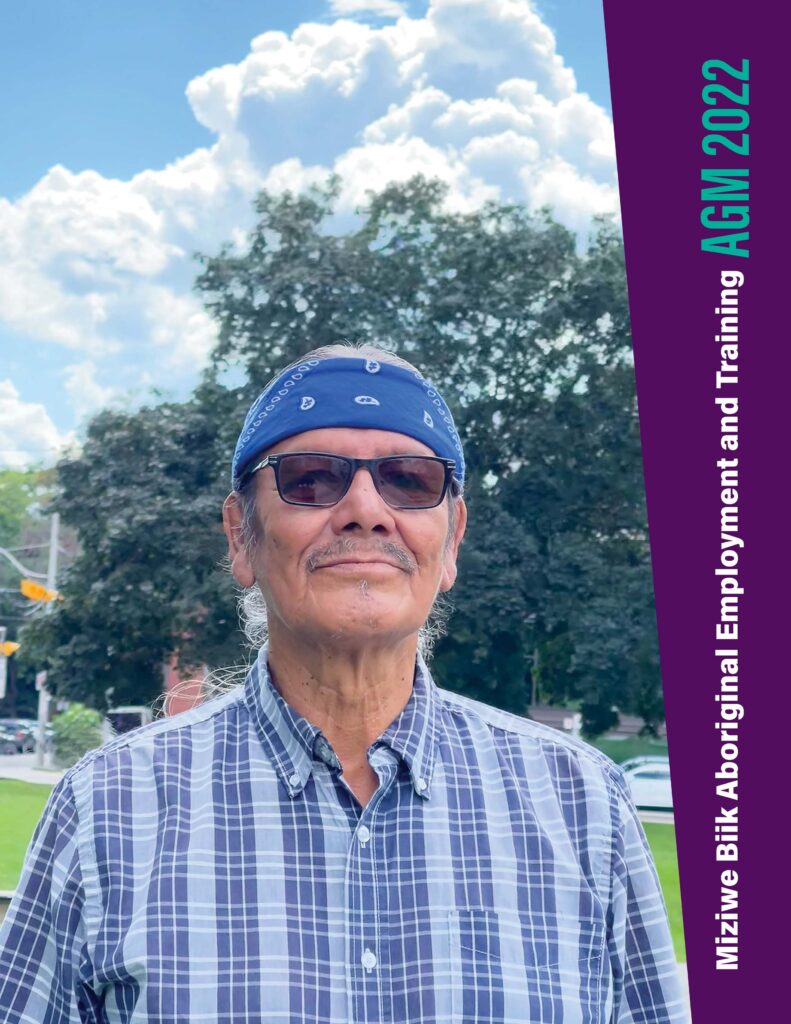 Cover of the 2022 Annual report showing a smiling man against a background of trees